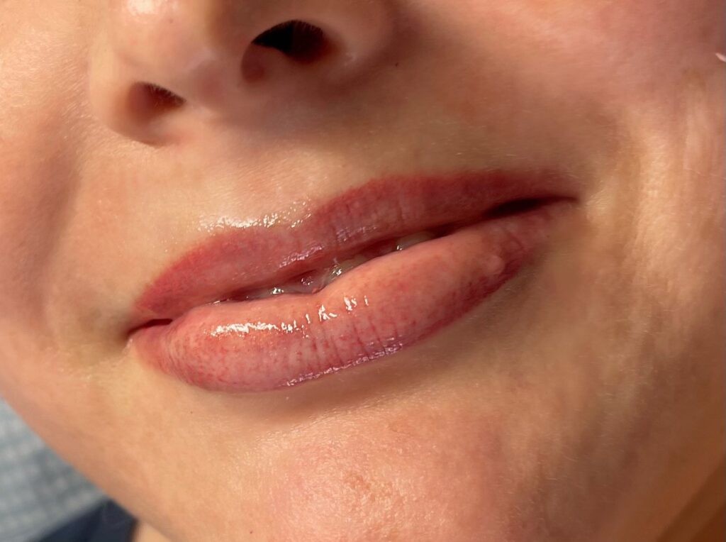 A close up of a woman's lips at home.